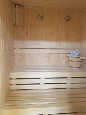 a sauna with a bench in the middle of it at Flat in Hughada Aqua Palms 52 M2 in Hurghada