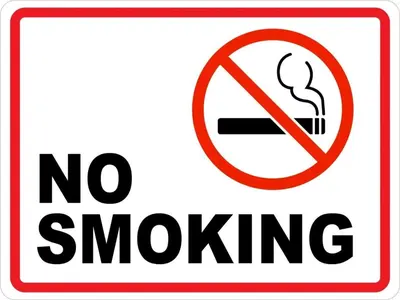 a sign with a no smoking sign on it at Flat in Hughada Aqua Palms 52 M2 in Hurghada