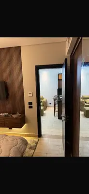 a bedroom with a door open to a living room at Hurghada in Hurghada