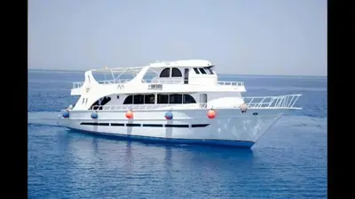a large white boat in the water at Funnydivers Diving center in Hurghada