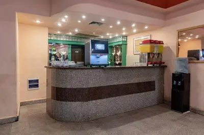 a bar in a restaurant with a counter at Apartment Empire Hotel in Hurghada
