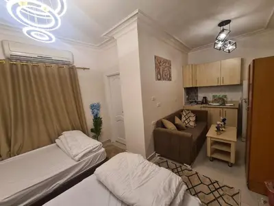 a living room with two beds and a couch at Chalet for rent near the sea Services and tourist walkway in Hurghada