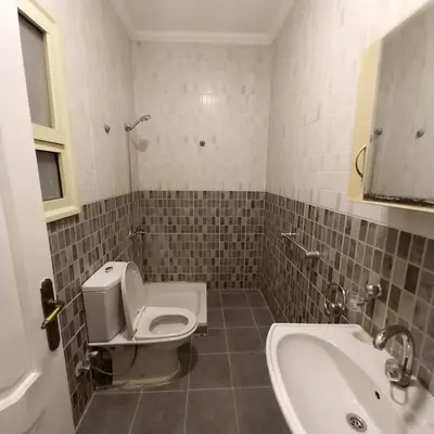 a bathroom with a toilet and a sink and a tub at Chalet for rent near the sea Services and tourist walkway in Hurghada