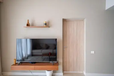 a flat screen tv sitting on top of a wooden table at Elegant Fanadir Marina 2BR • Ground Floor in Hurghada
