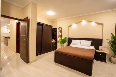 a bedroom with a large bed in a room at Nile Crown Luxor in Luxor