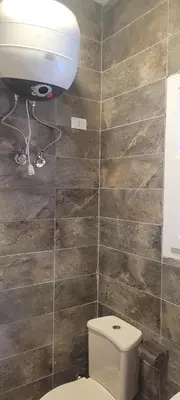 a bathroom with a toilet and a sink at Gamela in Hurghada