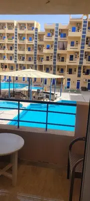 a view of a swimming pool from a balcony of a building at Gamela in Hurghada