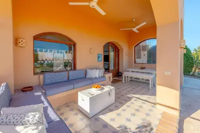 a living room with a couch and a table at Rihanna apartment direct to the sea in Hurghada