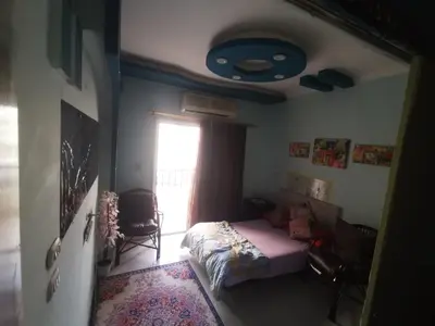 a bedroom with a bed and a window at Lotus Stay شاليه مفروش بالغردقة in Hurghada