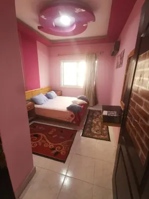 a bedroom with a bed and a purple ceiling at Lotus Stay شاليه مفروش بالغردقة in Hurghada