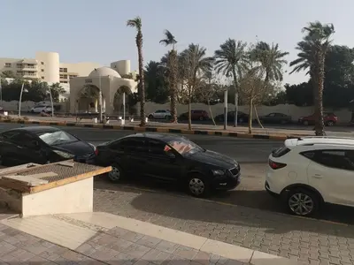 a group of cars parked on the side of a street at Lotus Stay شاليه مفروش بالغردقة in Hurghada