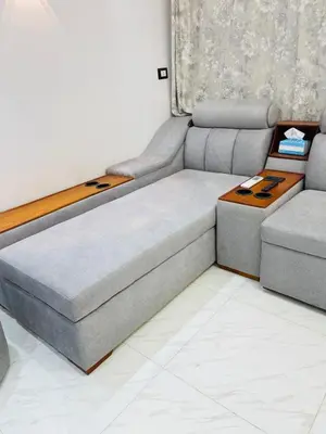 a couch and a table in a room at Comfortable & Modern Appartement in Luxor