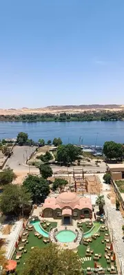 an aerial view of a resort with a swimming pool at شقة كورنيش النيل 3غرف فيو كامل علي النيل in Aswan