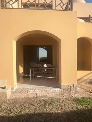 a patio with a table and chairs in a building at Studio sea view in Hurghada