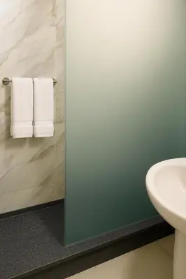 a bathroom with a sink and a toilet and towels at Tiba Golden Resort with private Beach in Hurghada