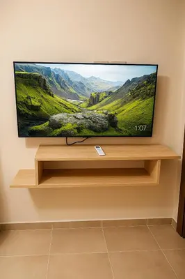 a flat screen tv sitting on a shelf at Tiba Golden Resort with private Beach in Hurghada