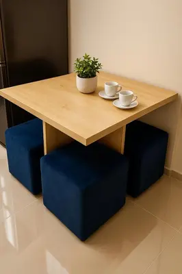 a wooden table with two cups and a potted plant at Tiba Golden Resort with private Beach in Hurghada