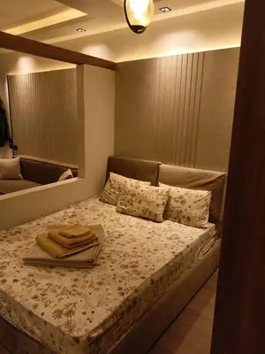 a bedroom with a bed with towels on it at Palma House in Hurghada