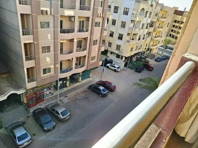 an aerial view of cars parked in a parking lot at Florenza Khamsin, Studio i415-B in Hurghada