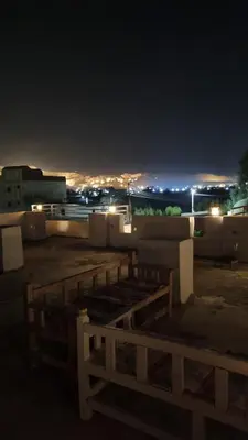 a view of a city at night with lights at Villa Saeed in Al Karnak