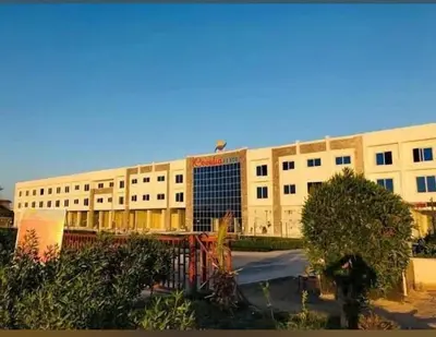a large white building with a lot of windows at Cecelia Resort - Studio chalet in Hurghada