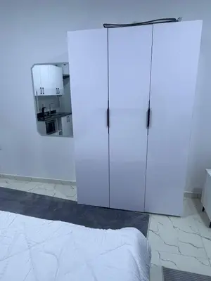 a white cabinet in a room with a bed at الغردقه الشيراتون القديم in Hurghada