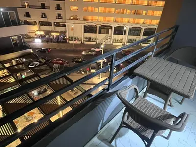 a balcony with a table and chairs in a building at الغردقه الشيراتون القديم in Hurghada