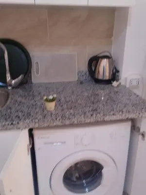 a washing machine in a kitchen with a counter at Hurghada Apartment sea view Fiesta 209 in Hurghada