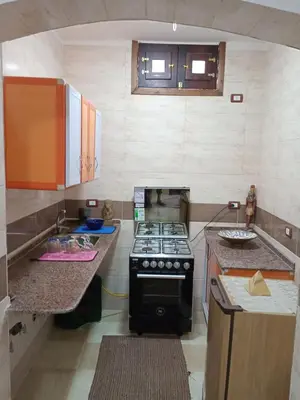 a kitchen with a stove and a sink at Maat Studio in Luxor