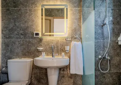 a bathroom with a sink and a toilet and a mirror at Anoush Dahabiya 7 nights from Luxor to Luxor each Monday in Luxor
