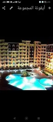 a large swimming pool in front of a large building at Florenza khamsin Resort Hurghada Red Sea in Hurghada