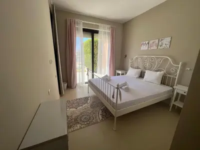 a bedroom with a white bed and a window at Tawila 3BR Family Townhouse • Lagoon Retreat Villa in Hurghada