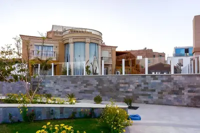 a house with a retaining wall and a garden at Selena Bay Boutique Hotel in Hurghada
