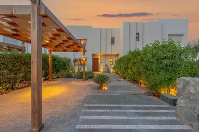 a building with a walkway in front of a building at Charming Jungle Home in Hurghada