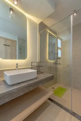 a bathroom with a sink and a mirror at Charming Jungle Home in Hurghada