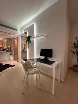 a white desk with a computer on it in a living room at El Gouna - 3 Bedroom - Rooftop-Pool - Ancient Hills in Hurghada