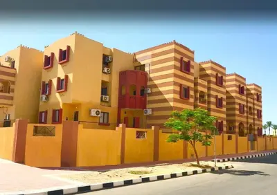 a fence in front of a building at Apartment in port Ghalib in Port Ghalib