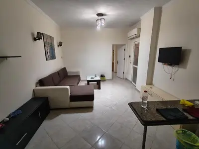 a living room with a couch and a table at Apartment in port Ghalib in Port Ghalib