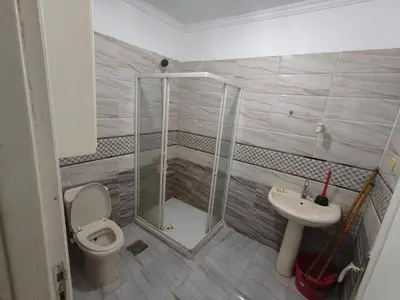 a bathroom with a shower and a toilet and a sink at Apartment in port Ghalib in Port Ghalib