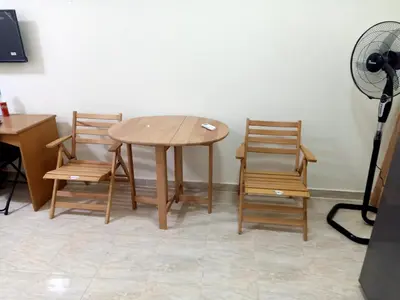 a table and two chairs in a room at Sun and fun Hurgadah Apartments in Hurghada