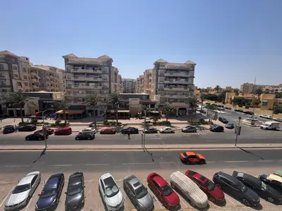 a group of cars parked in a parking lot at Modern loft overlooking downtown in Scandic Resort in Hurghada