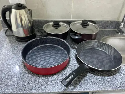a kitchen counter with two pans and pots on it at Bayt Hassan S10 - Fabulous one bedroom apartment in Hurghada