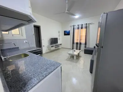 a kitchen with a sink and a counter top at Bayt Hassan S6 - Cosy 1 bedroom apartment in Hurghada