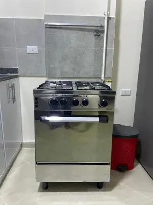 a stainless steel stove in a kitchen with at Bayt Hassan S6 - Cosy 1 bedroom apartment in Hurghada