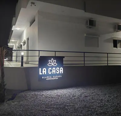 a building with a sign that reads la cason at Arabic Apartment in Hurghada