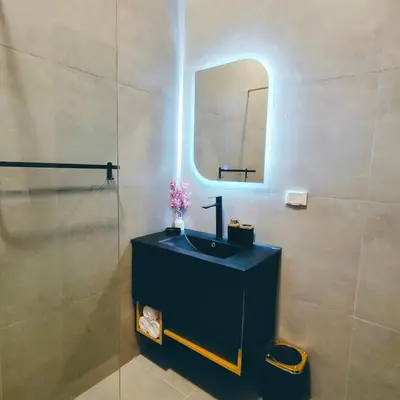 a bathroom with a sink and a mirror at Ocean Apartment in Hurghada