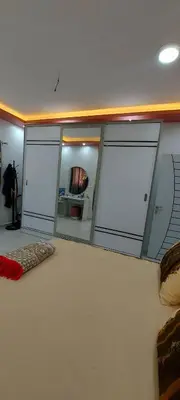 a room with three sliding glass doors in a room at Sila in Hurghada