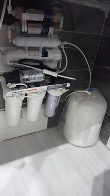 a shelf filled with cups and a pile of papers at Sila in Hurghada