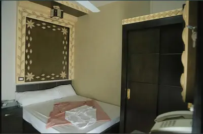 a small bedroom with a bed and a window at El Massa in Idfu