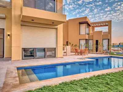 a house with a swimming pool in front of a house at El Gouna Villa in Tawila with private pool in Hurghada